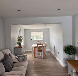 A living room with a dining table and sofa at 15 Lamsey Lane King's Lynn