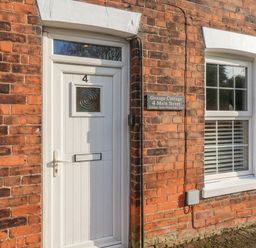 A door with a house number at Grange Cottage 4 Main Street in Hull