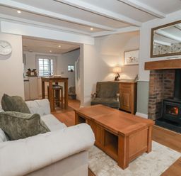 A living room with a sofa and coffee table at No.4 Main Street in Hull