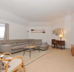 A living room with a sofa and coffee table at Cribba in Port Isaac