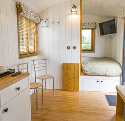 A bedroom with a bed and chair at No 2 The Parkland Upton Warren