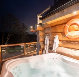 An outdoor deck with a hot tub at The Lookout in Addingham