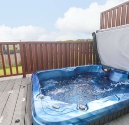 A hot tub on a deck in Pentewan - 67 Portreath