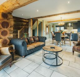 A living room with a sofa and coffee table at Keepers Cabin in Addingham