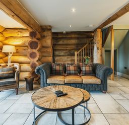 A living room with a sofa and chair at Keepers Cabin in Addingham