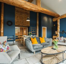 A living room with a sofa and chairs near a coffee table at The Farmhouse in Addingham