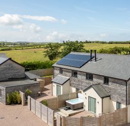Houses with solar panels and a hot tub at Bell House in Llanfechell