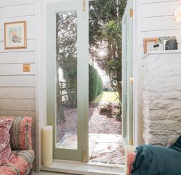 A view through an open door from the living room at Shades Farm Cabin in Cirencester