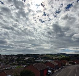 A view of clouds and hills from a parking area at Upper Longlands Dawlish