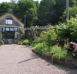 A house with a garden and gravel pathway at Horse Gin in Parkend