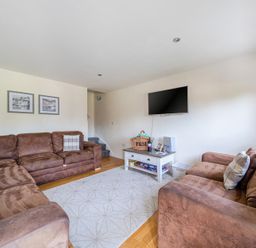 A living room with a sofa and television at James Ville Marina Lodge 9 in Brigg