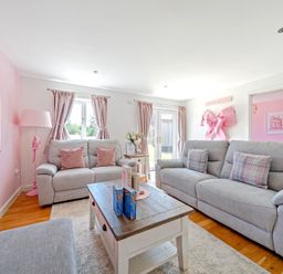 A living room with a sofa and coffee table at James Ville Marina Lodge 23 in Brigg