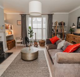 A living room with a sofa and coffee table at The Secret Garden in Narberth