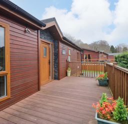 An outdoor deck area with planters at Waters Edge Lodge Windermere