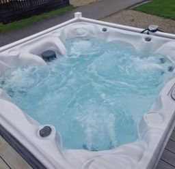 A hot tub with water jets in an outdoor area at Barney's Retreat in Newquay