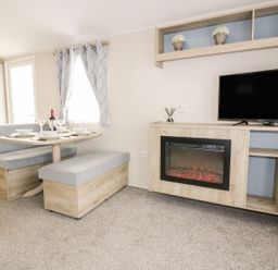 A dining room with a table and benches at Barney's Retreat in Newquay