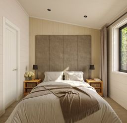 A bedroom with a bed and bedside tables at Lonscale (Pet) Penrith