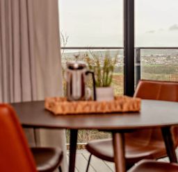 A dining room with a table and chairs at Whalesborough Penthouse 2.0 Marhamchurch