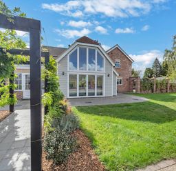 An exterior view of a house with a pathway and garden at Oldfields in Bury St Edmunds