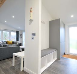 A living room with a sofa and coffee table at 20 Meadow Retreat in Dobwalls