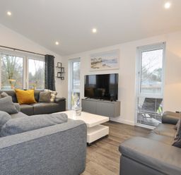 A living room with a sofa and television at 20 Meadow Retreat in Dobwalls