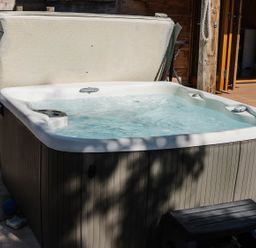 A hot tub with cover in an outdoor area at The Chard in Carlisle