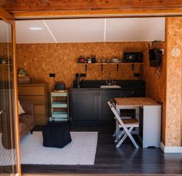 A studio with a kitchenette and seating area at The Chard in Carlisle