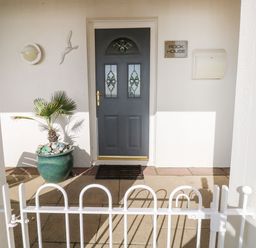 An entryway with a door and plant at Rock House in Narberth
