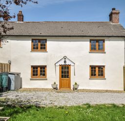 A house with a front door and windows at Little Blagdon in Ashwater