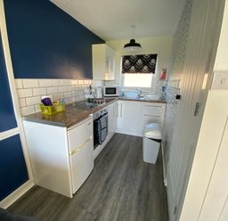 A kitchen with appliances and countertop at Chalet 333 California, Norfolk