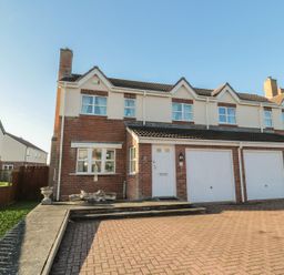 A house with a garage and driveway at Sandy Cove in Chathill