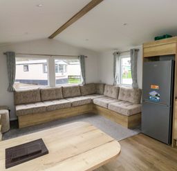 A living room with a sofa and television at Valley 36 in Kingsbridge