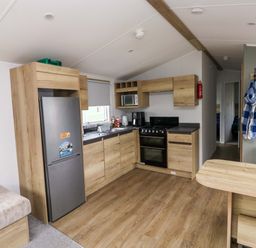 A kitchen with appliances and cabinets at Valley 36 in Kingsbridge