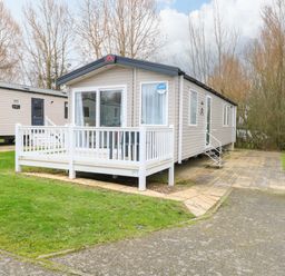 A caravan with a porch and stairs at Caravan in Great Yarmouth