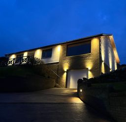 A house with outdoor lighting at Tigh-Na-Mara Retreat in Spittal