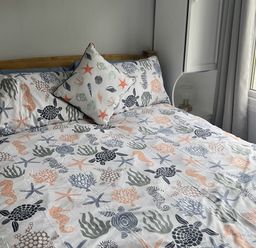 A bedroom with a bed and decorative pillows at Chalet - Buckland 16, Bideford