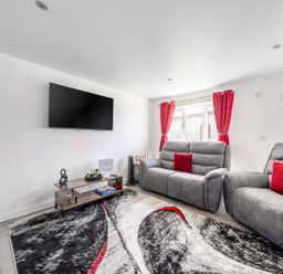 A living room with a sofa and TV at Ruby Red near Brigg