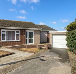 A house with a driveway and garage at Orme View Penmaenmawr