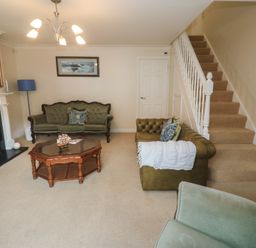 A living room with a sofa and coffee table at 16 Forth An Nance in Portreath
