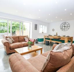 A living room with sofas and a dining table at The Ivy in Norwich