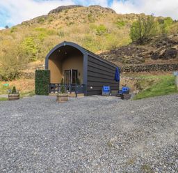 A house with outdoor seating and gravel area at Bluebelle - Crossgate Luxury Glamping in Hartsop