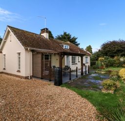 A house with a garden and patio at Barton Lodge in Porlock