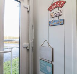 An entrance with signs on the wall at Fairways 22 Lincoln