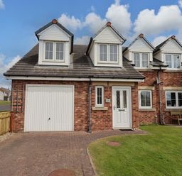 A house with a garage and a lawn at 35 Longbeach Drive