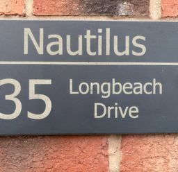A nameplate displaying Nautilus at 35 Longbeach Drive Beadnell