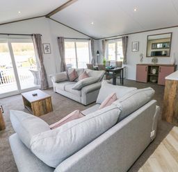 A living room with sofas and a coffee table at Dukes Meadow in Carmarthen