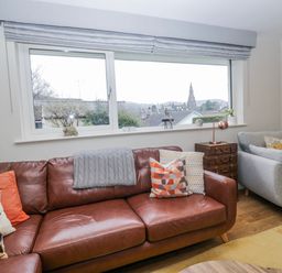 A living room with a sofa and window at Ambwray in Ambleside