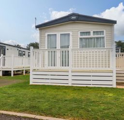 A mobile home with decking and steps at Derwent L4 in Par