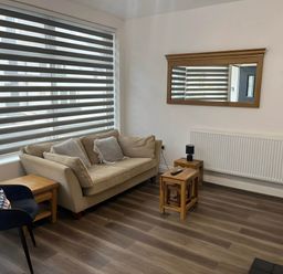 A living room with a sofa and coffee table at Llangollen - House - Sleeps 8- Garden in Llangollen