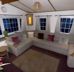 A living room with a sofa and coffee table at Llanarmon-yn-Ial Mold 3-Bed Caravan, Sleeps 6 Llanarmon-Yn-Ial